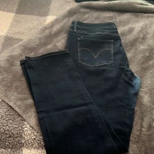 Dark blue Levi brand jeans. Size 14 mid rise skinny